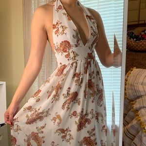 Floor length halter top paisley patterned dress